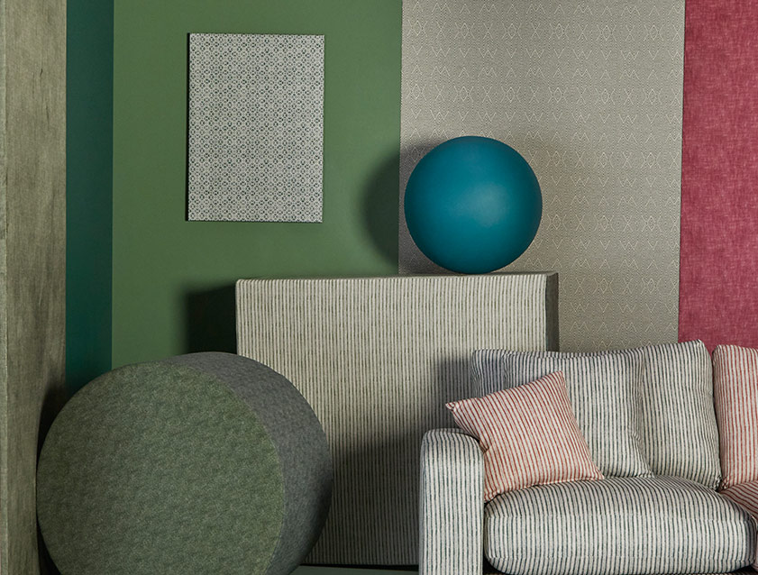 Stockbridge 2.5 seater sofa in Sussex Spill Resistant Stripe Forest and Brick with background in mixed fabrics